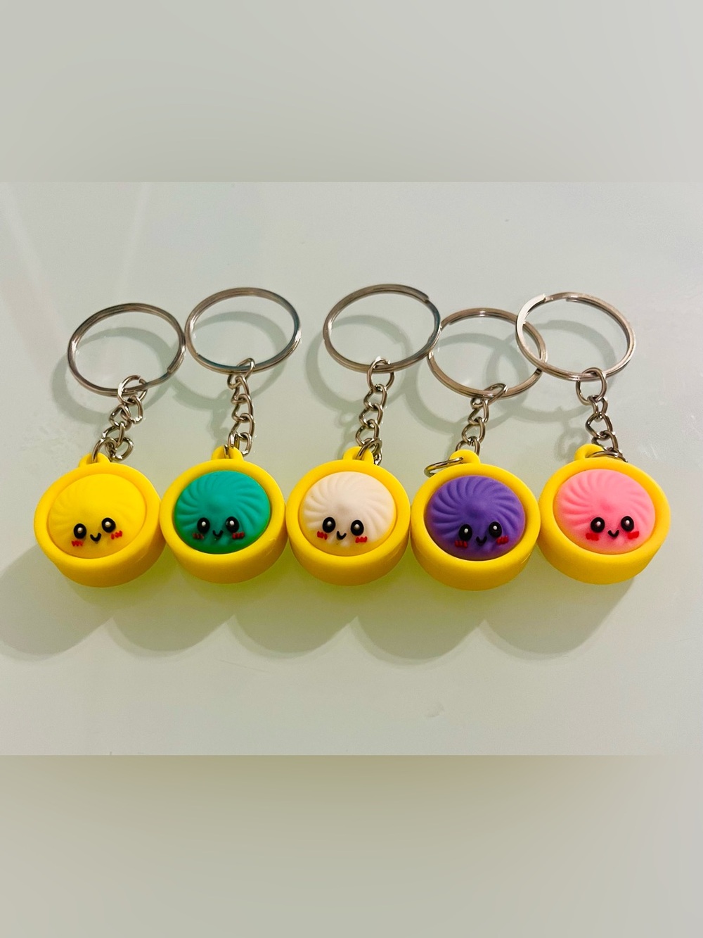 5 Pack Cute Dumpling Keychain Set - Yellow Case with Multicolor Faces